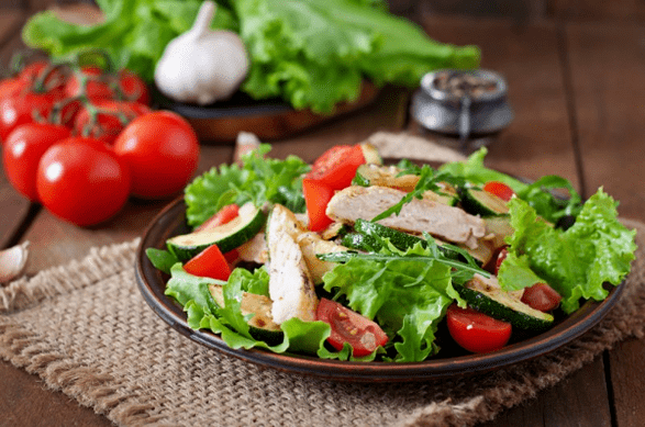 Chicken and vegetable salad is a great option for a light dinner after a workout. 
